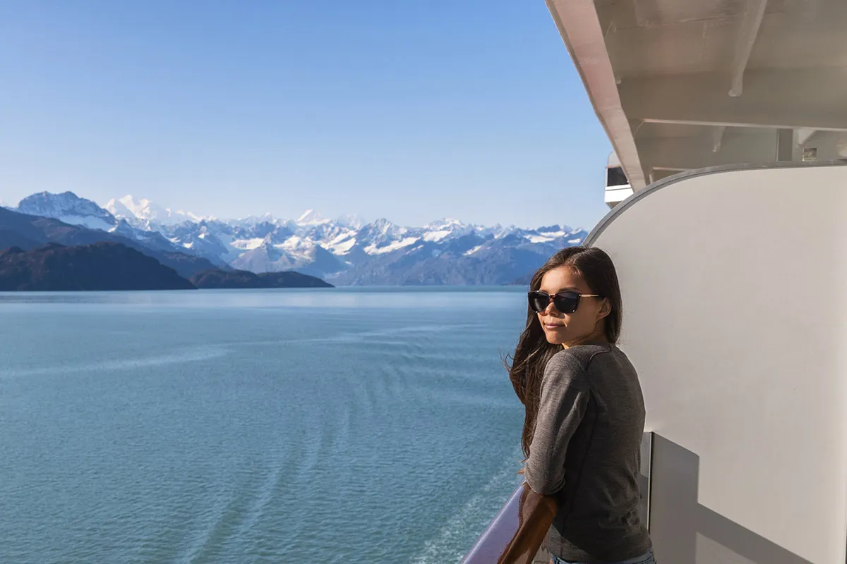 Woman on a balcony of her Alaska cruise