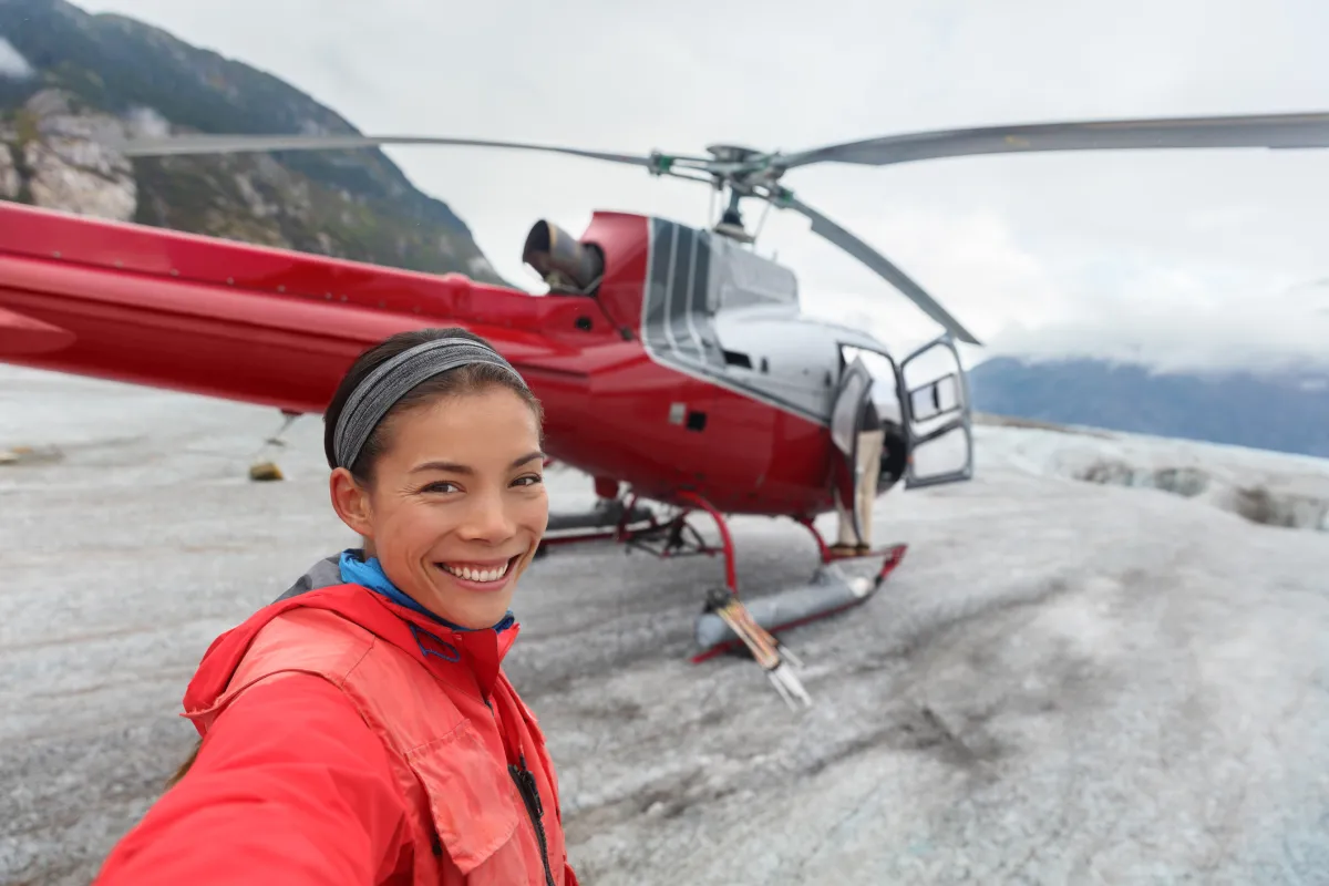 woman taking selfie on helicopter excursion