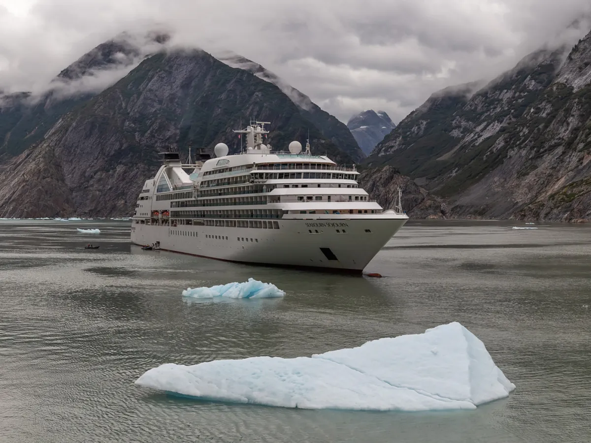 Cruise ship drifting by iceberg 